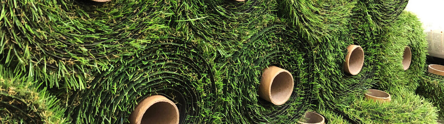 Stacked rolls of artificial turf