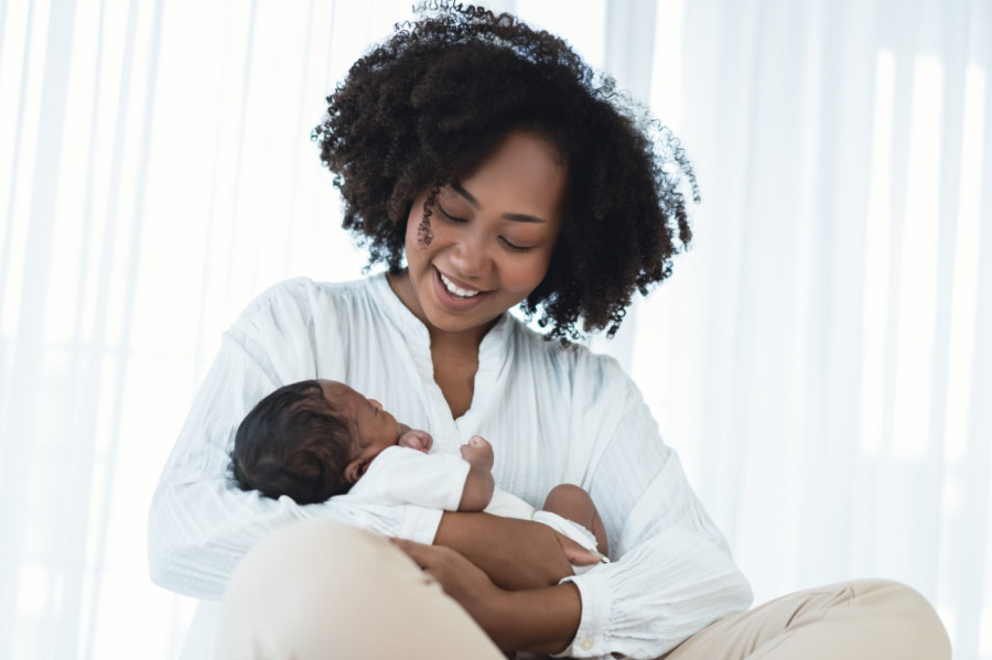 mother holding newborn baby