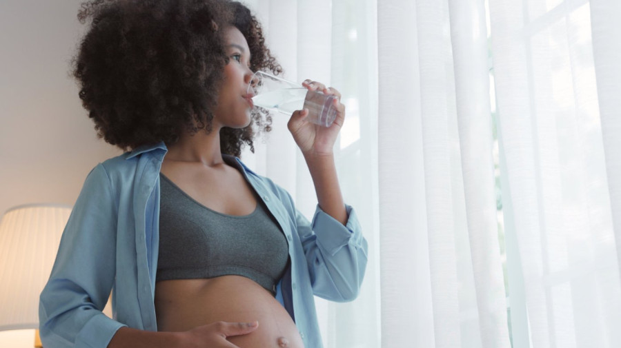 Pregnant woman drinking water