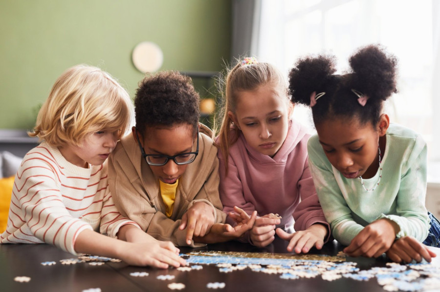 Children working on a puzzle