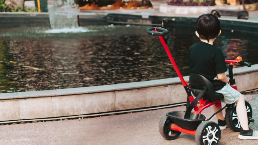 Boy on tricycle